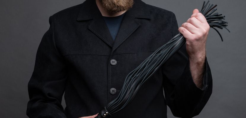 man_holding_whip.jpg
